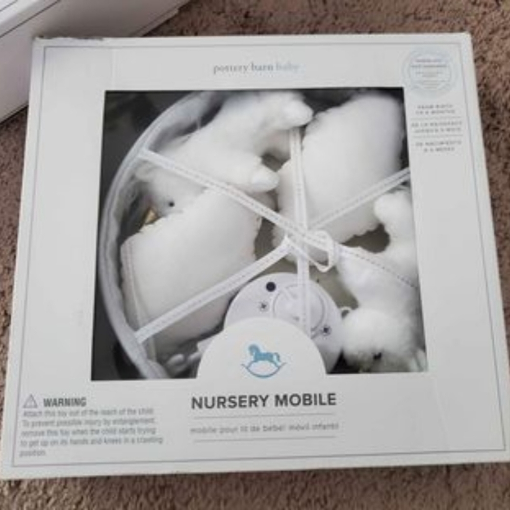 Pottery Barn nursery mobile and crib arm